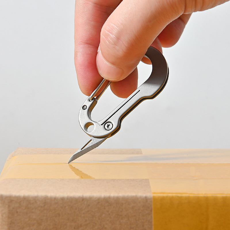 Mini llavero de aleación de titanio con mosquetón, cuchillo plegable de bolsillo, herramientas portátiles